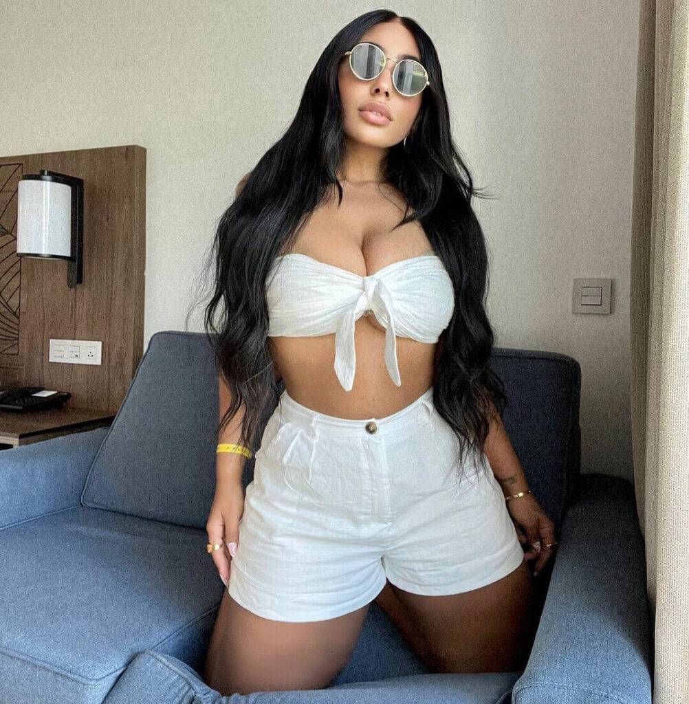 Yemaya Guzman Shoulder Flounce Sleeve Top SXY Curvy High Waist Ripped Denim Shorts and sunglasess