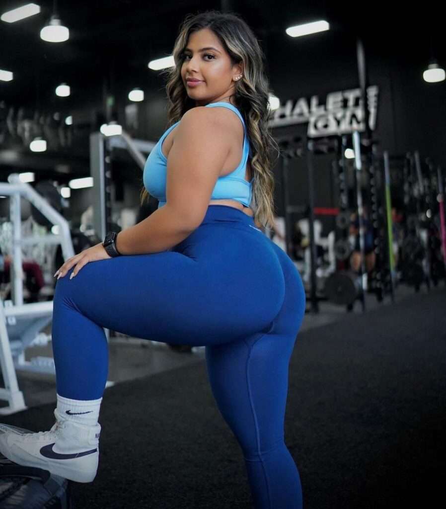 Nanki Malik in the gym wearing blue gym legging sets and nakie blazers