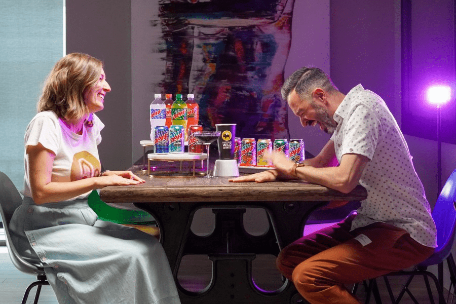 Rand Fishkin laughing while sitting in the front of a lady