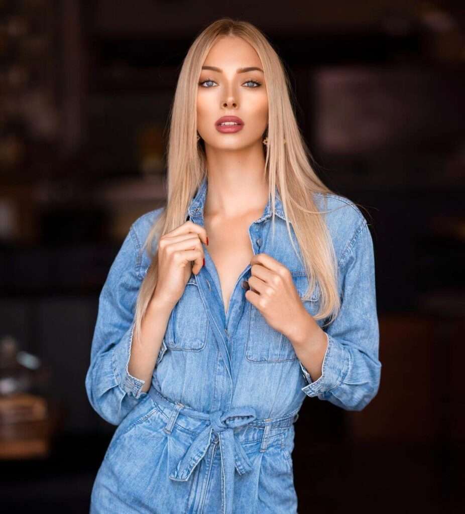 Maria Willhauk in a stylish denim outfit while poses for photograph