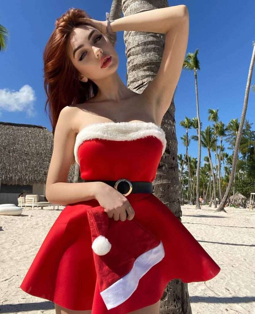 Yana Ruppel in a sexy christmas outfit while looking towards the camera