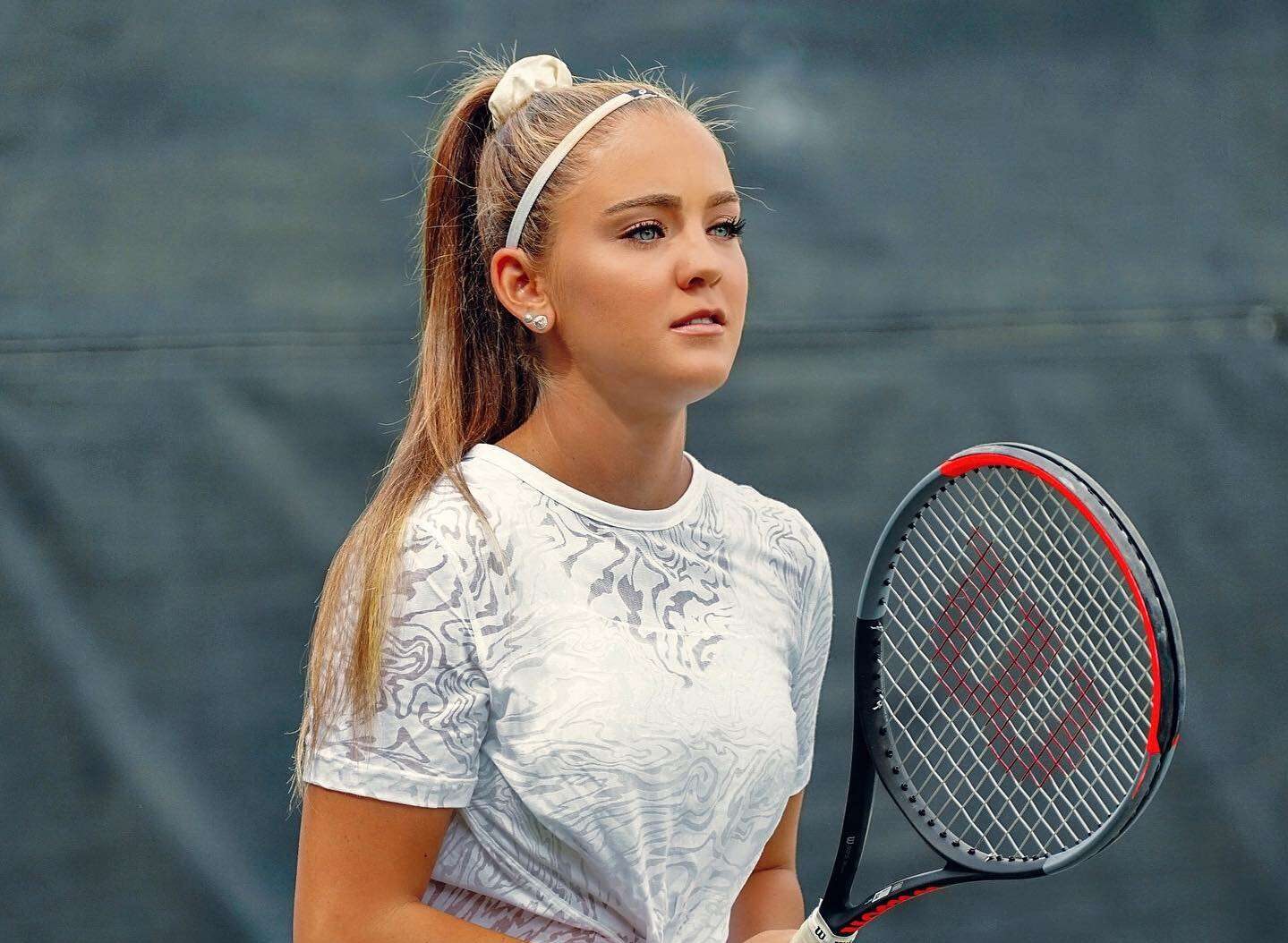 Charlotte Robillard in a t-shirt with matching leggings while playing tennis