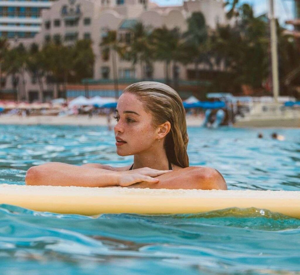 Olivia Dunne in a black swimwear while swimming