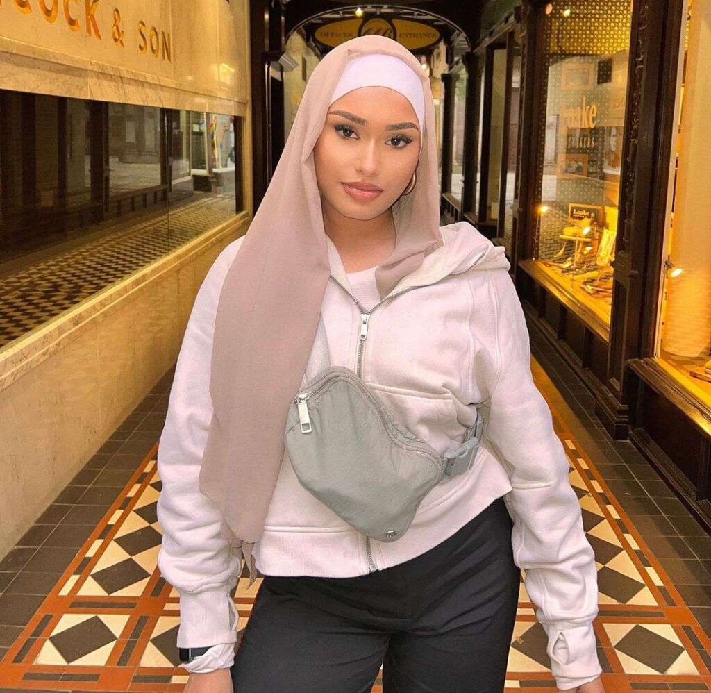 Thaslima Akkas is in pant shirt and in a Hijab as her clothing style is just an awesome.
