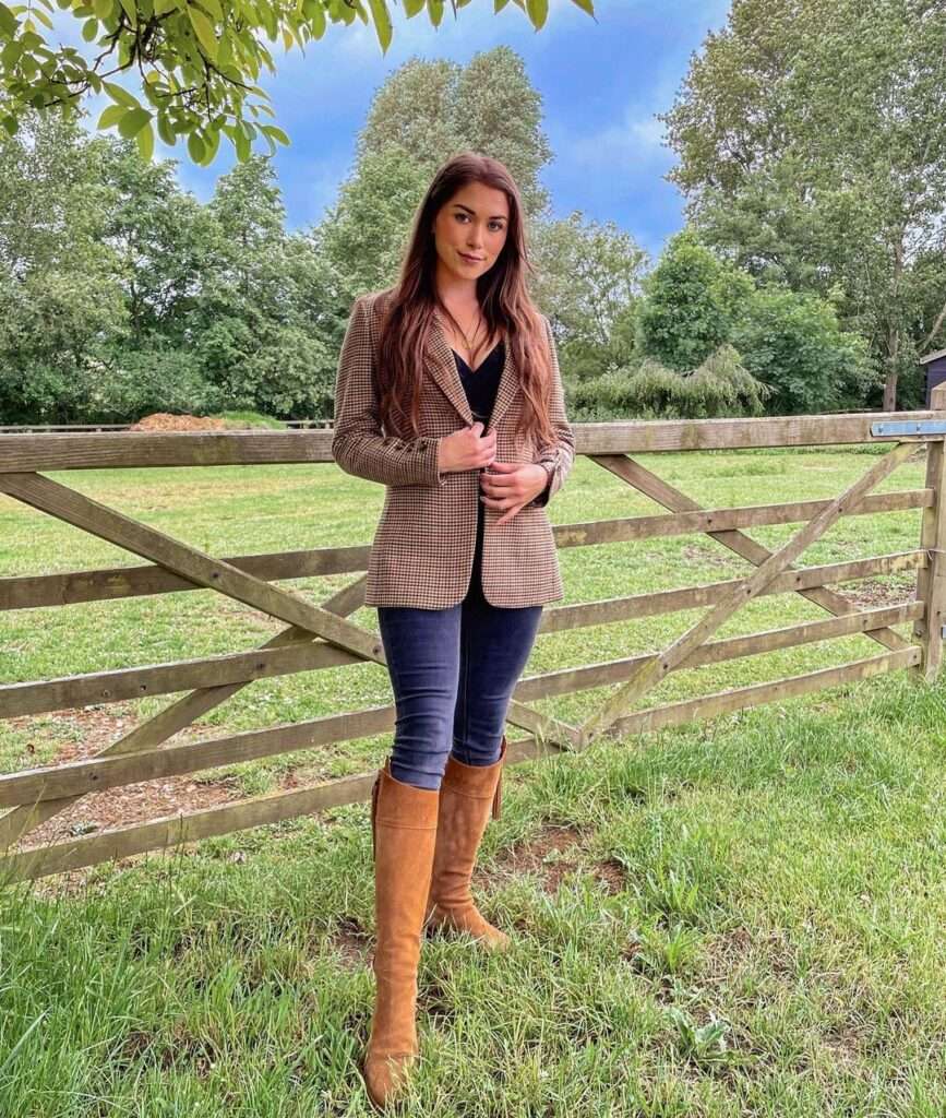 Charlotte Annaw is in jeans and coat showing the lifestyle and country fashion. she is a country girl.