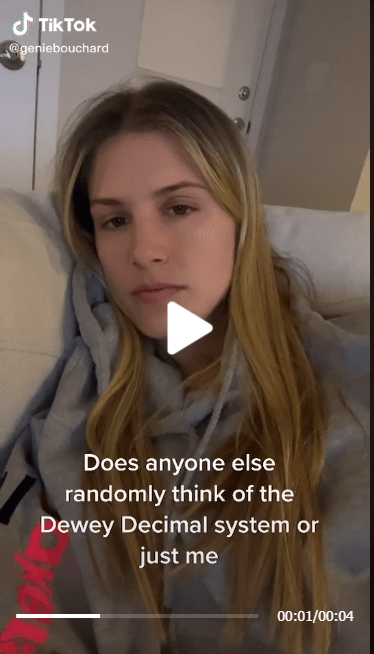 eugenie-bouchard  in a grey hoodie while making a lip-sync tiktok video