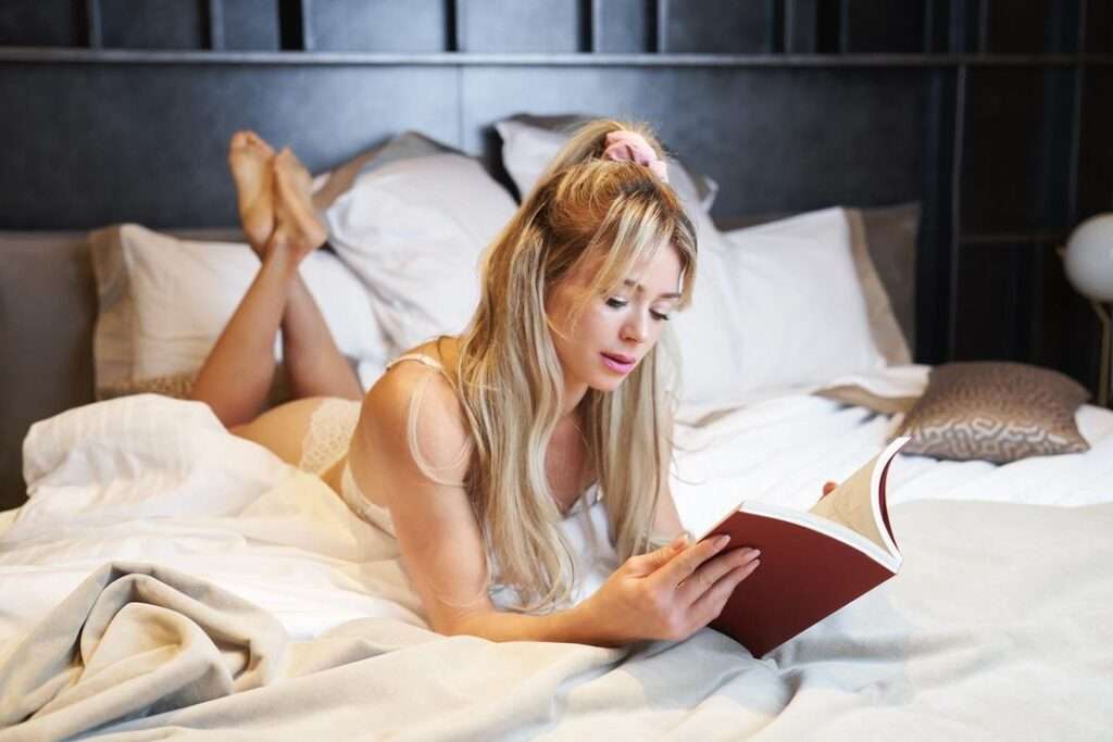 Camila Giorgi in a sexy outfit while reading a book in her bedroom