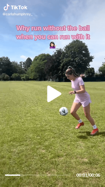 Carla Humphrey wearing a purple football costume while playing with a football in a TikTok video