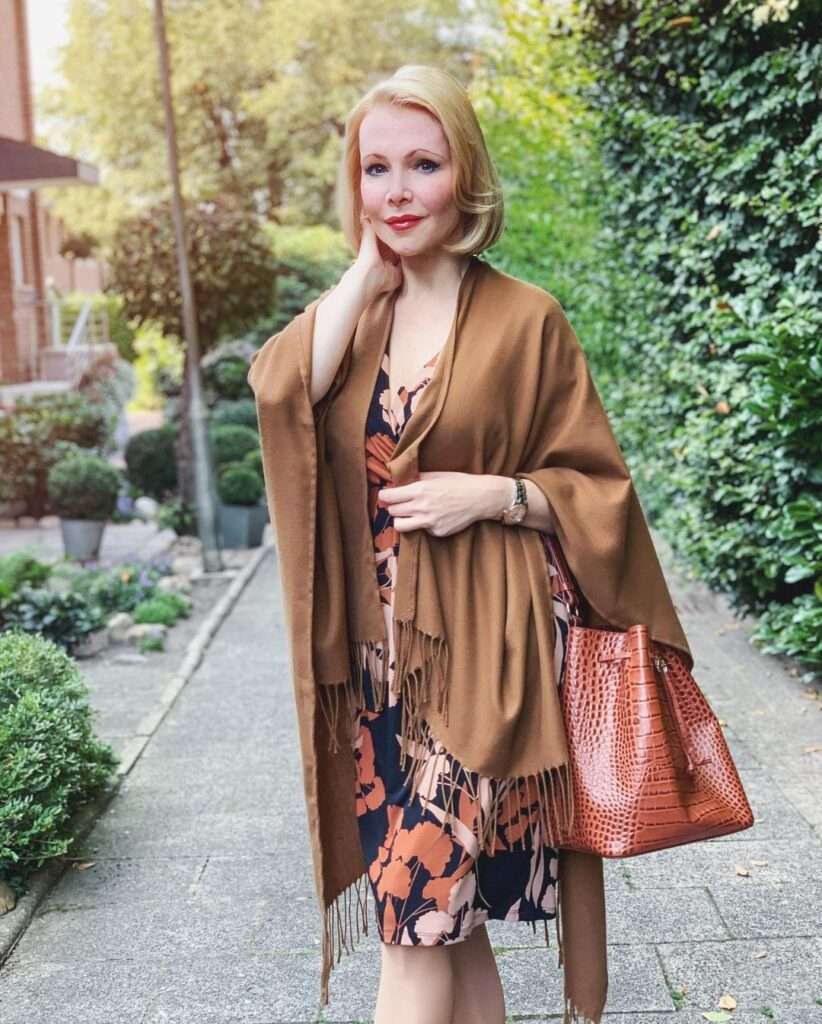 Classy Catrice is in short maxi with a shawl /scarf in winter collection.