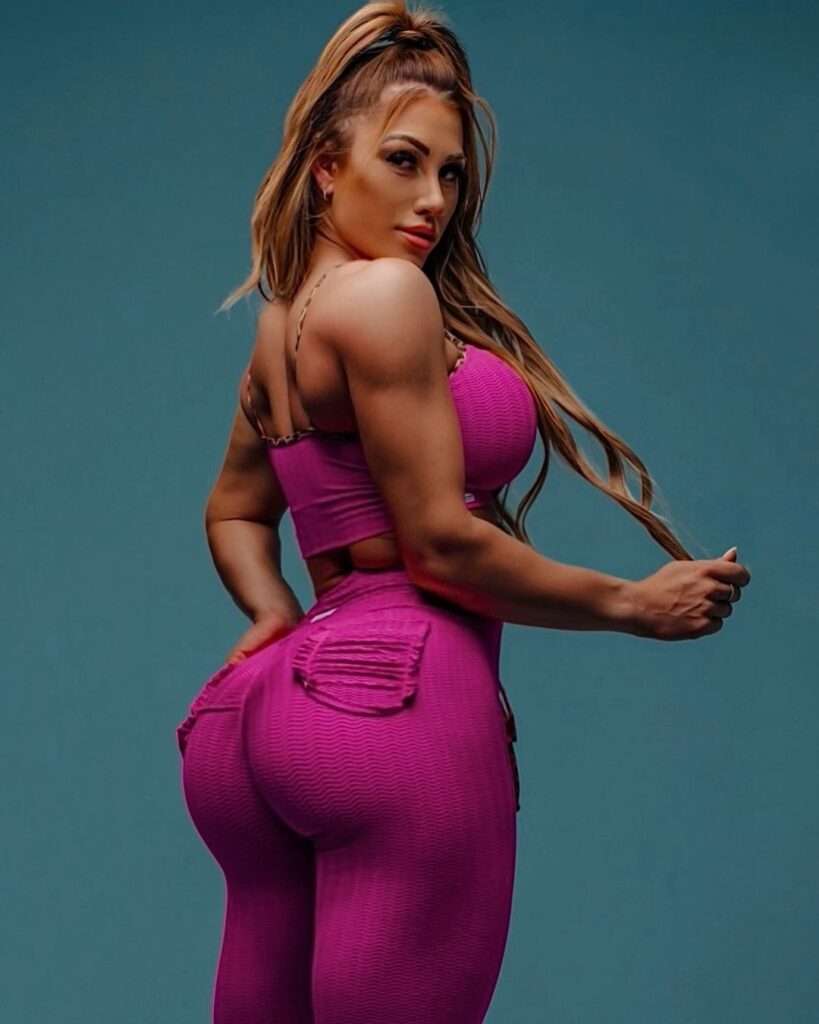 Caitlin Rice is a fitness model as she is wearing a two piece legging suit.