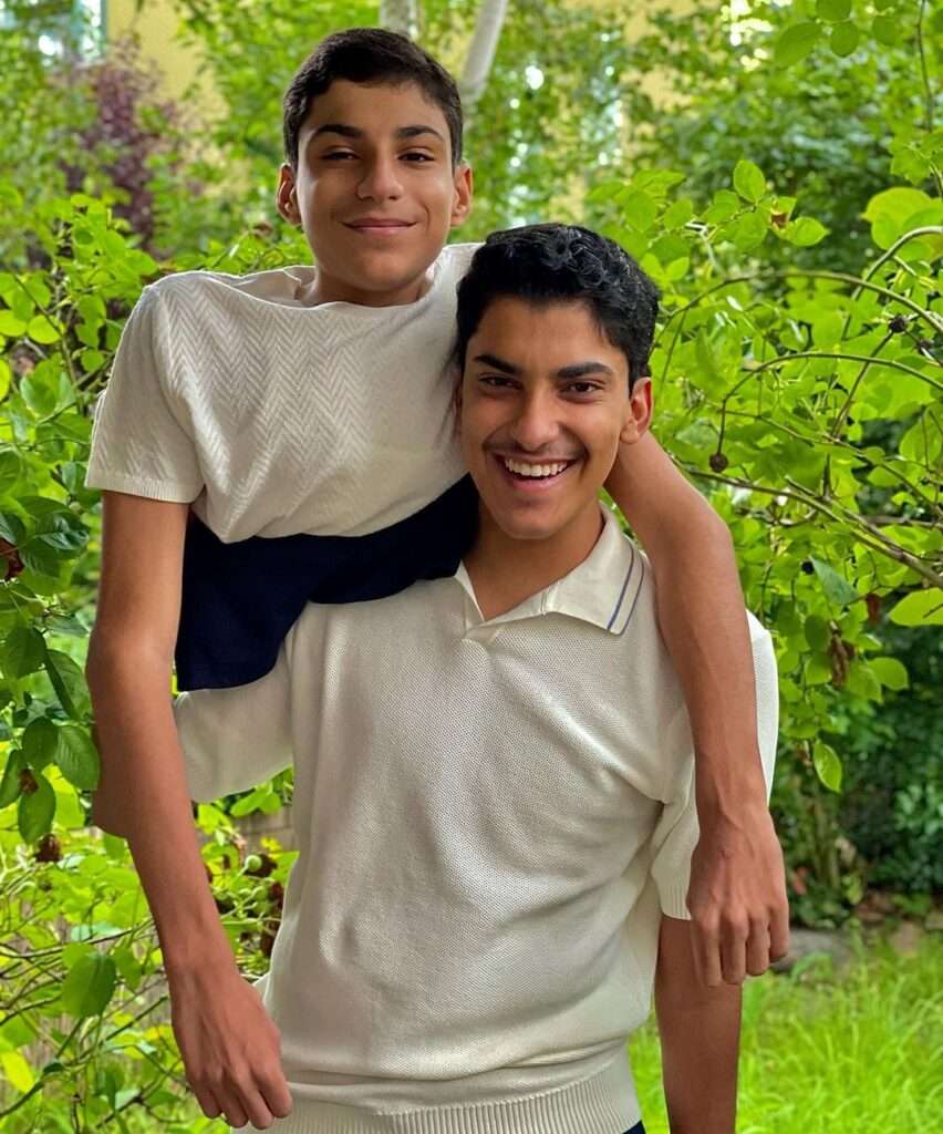 Ghanim Al-Muftah is with his twin brother Ahmad Al-Muftah and both are looking happy together.