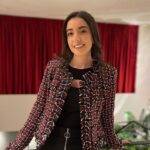 Joanna Bou Nasr in the black bodycon pair with printed jacket and smiling towards camera