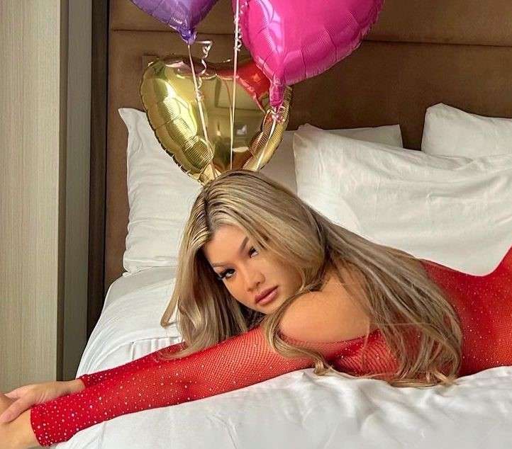 Jojo Babie is celebrating her birthday while wearing a red stylish outfit.