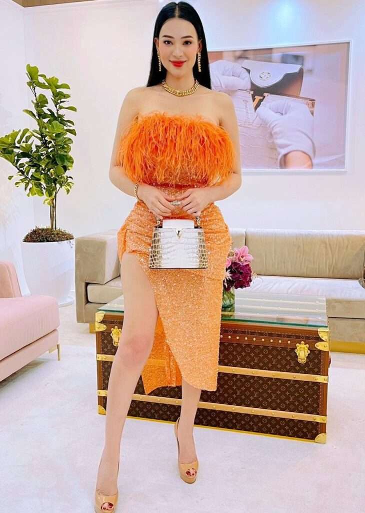 Sunshine Guimary is looking hot and stylish while wearing a stylish orange maxi.