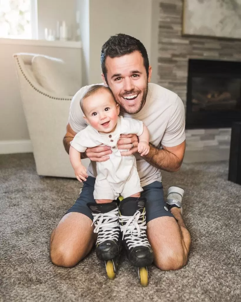 Daniel Labelle is posing for a picture with his cute baby and is looking so happy.
