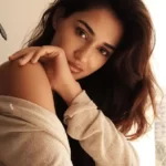 Disha Patani in is looking sexy in the brown shrug while looking towards camera