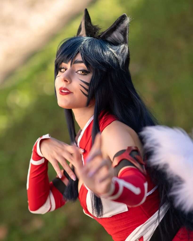 Ahri is wearing black gaming suit or posing while taking the picture