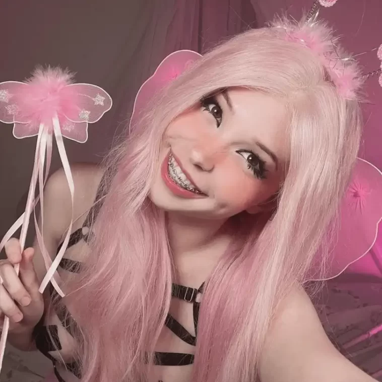Belle Delphine is wearing black bra and holding the butterfly pen or smiling while taking picture
