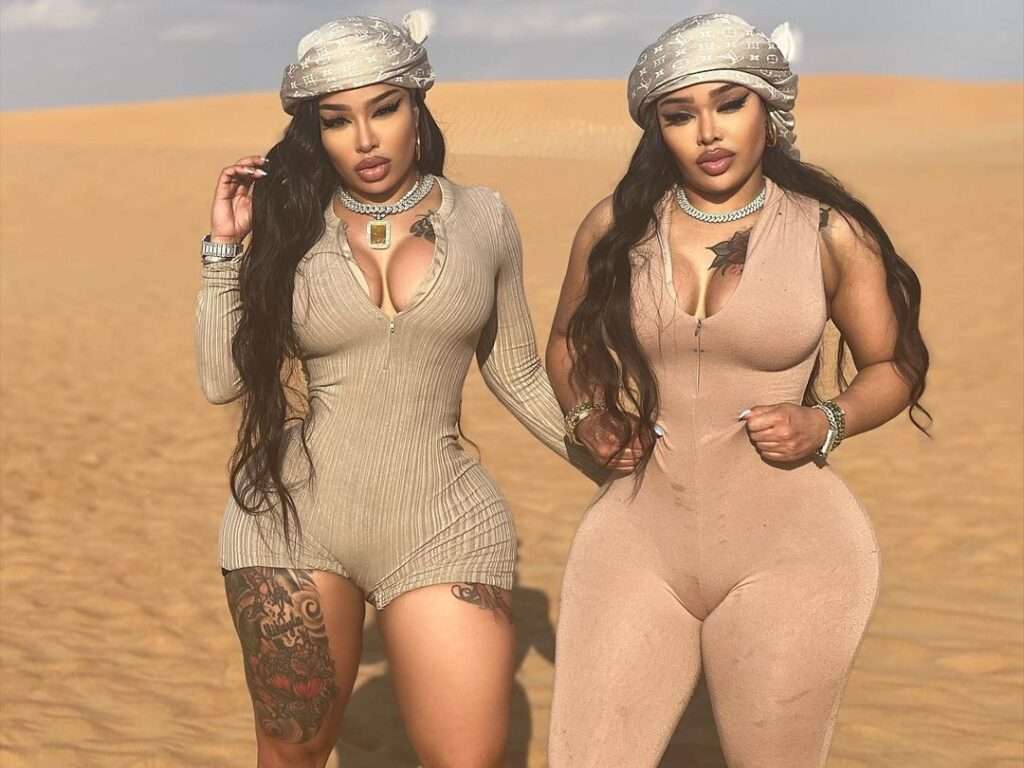 DoubelDose Twins are wearing fit clothes or standing in desert while posing for the picture