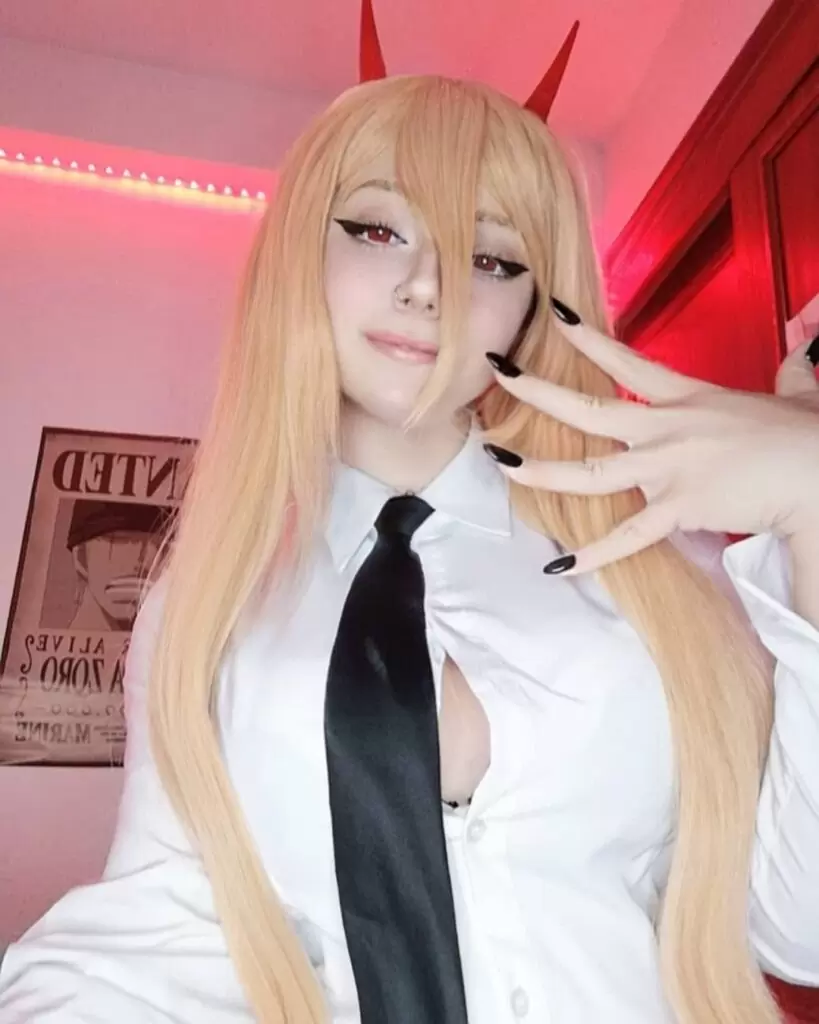 Kuro Kitsune is wearing white shirt and tie or posing while taking the picture