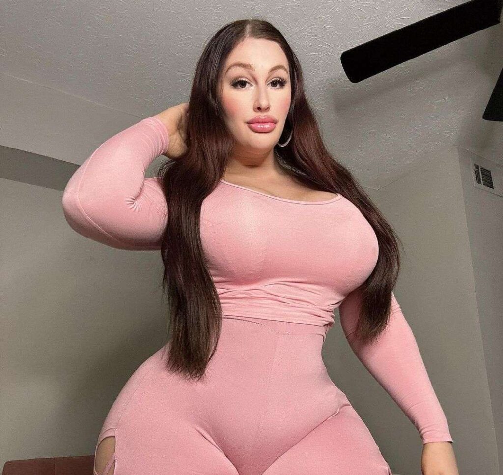 Lexi bunny in the pink 2-piece outfit outfit while poses for a photo