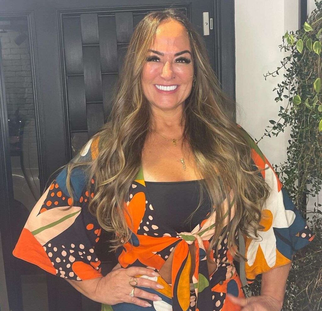 Nadine Gonçalves in the sexy printed outfit pair with a chain necklace while smiling towards camera