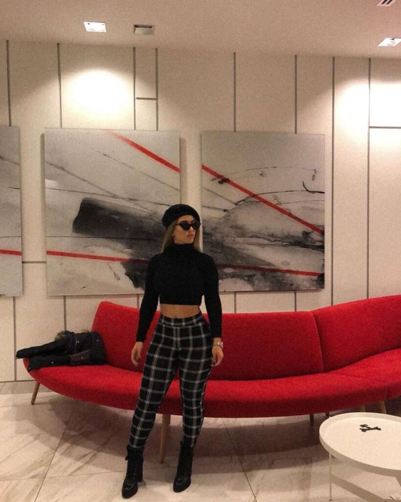 Twenty7heights in the black crop top pair with check pants, long pants, and cap