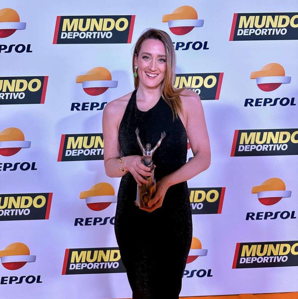 Mireia Belmonte in the black maxi style outfit pair with elegant jewellery while smiling towards camera