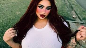 Alessabelle wearing white fitted top and red leggings with cat ears headband.